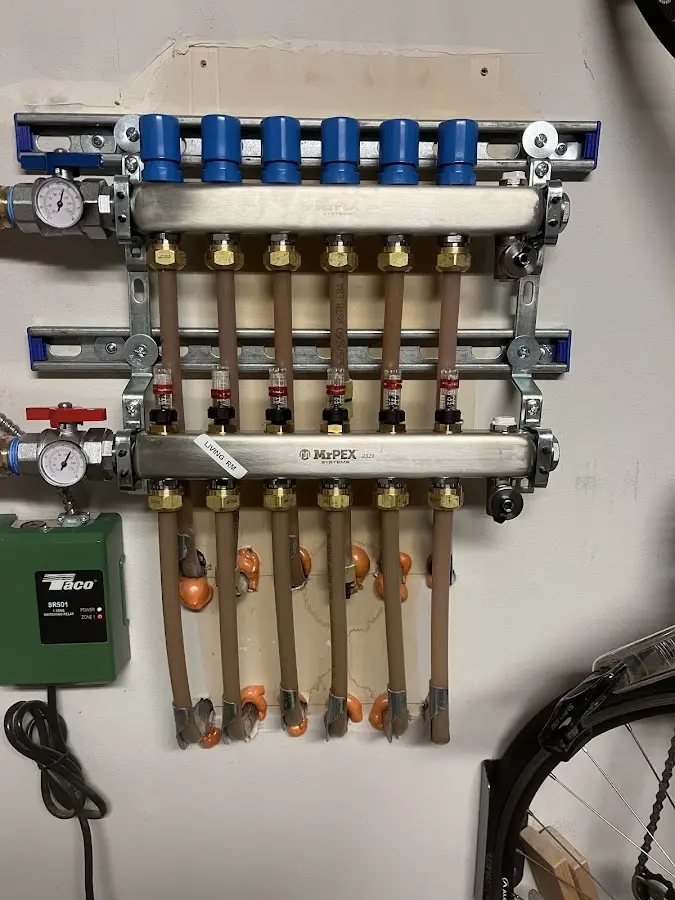 Plumber performing Gas Line Installation at a residential property in Falls